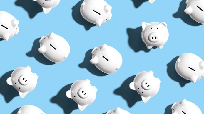 White piggy banks overhead view - flat lay